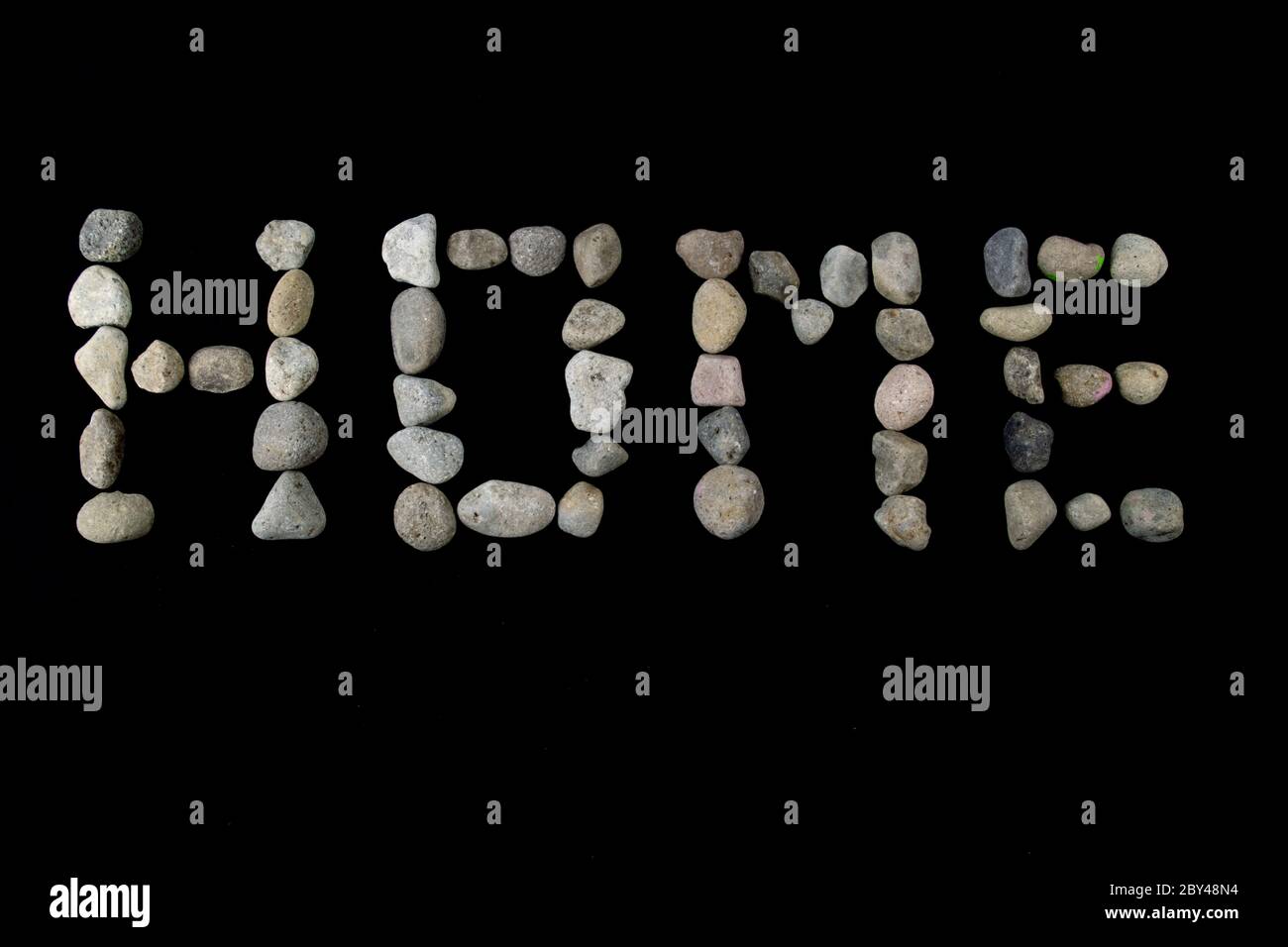 Home text on black color background with copy space using with stones Stock Photo