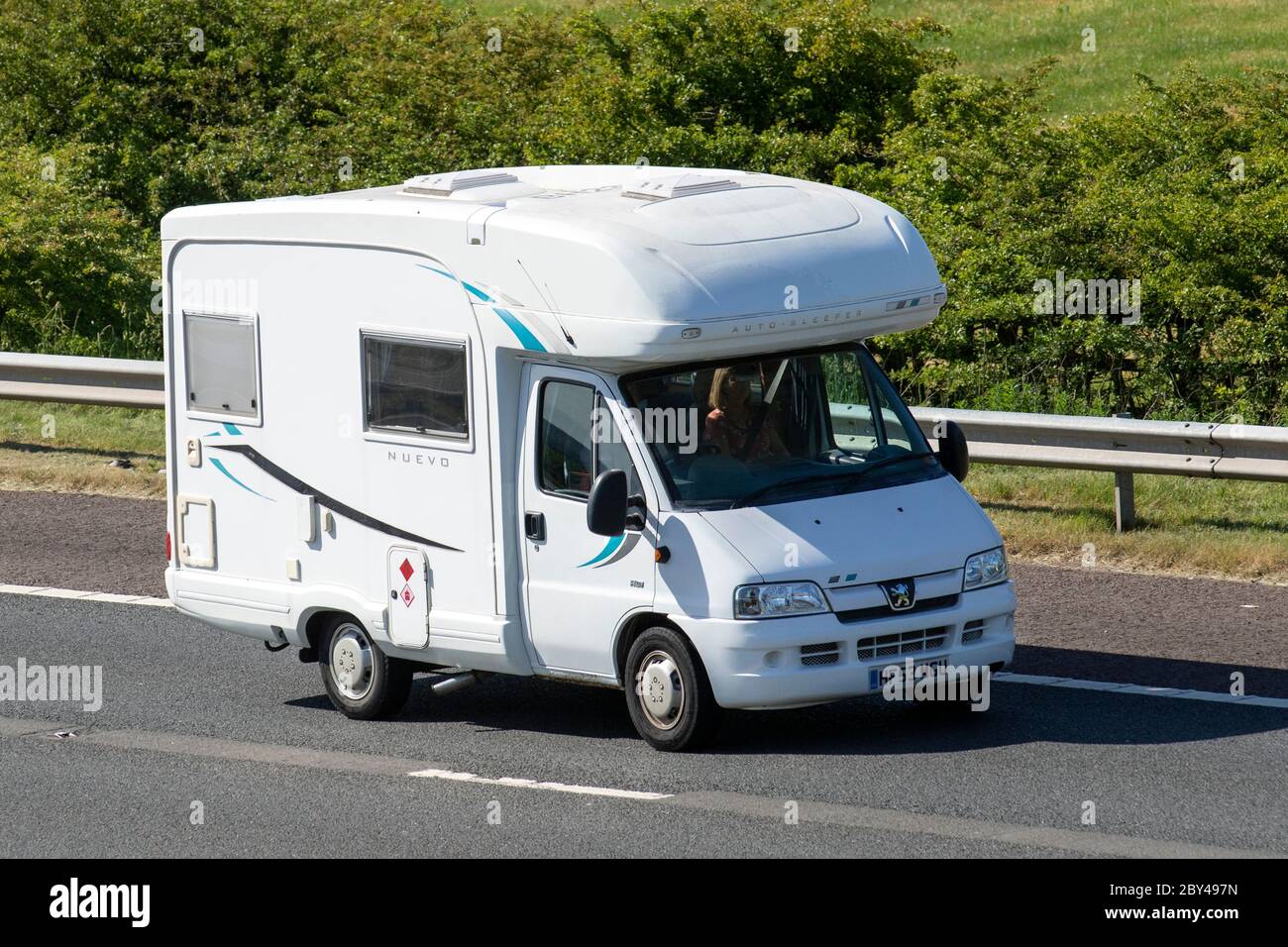 2004 white Peugeot Boxer 330 LX SWB HDI; Touring Caravans and Motorhomes, campervans, Nuevo RV leisure vehicle, family holidays, caravanette vacations, caravan holiday, life on the road, Stock Photo