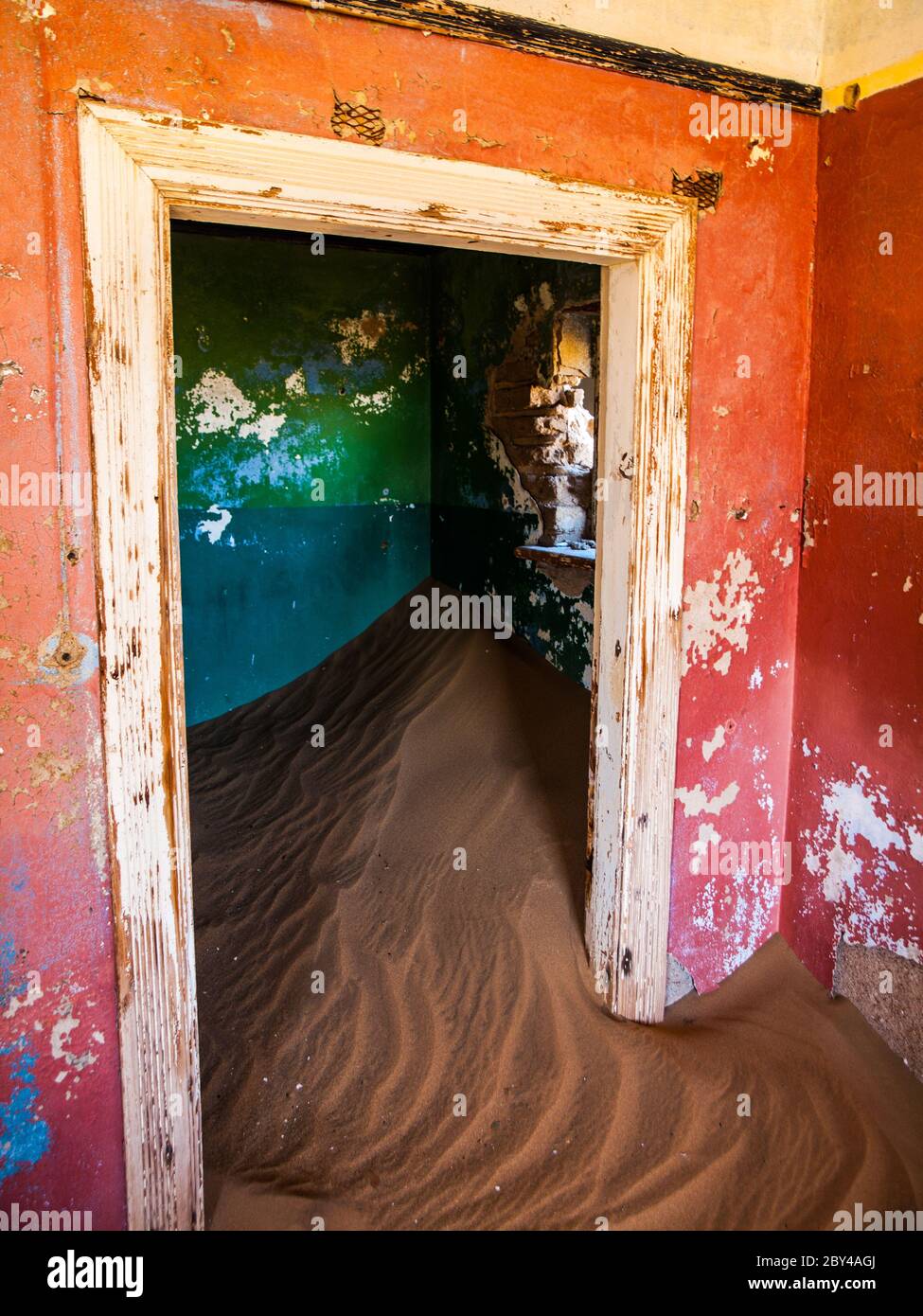 Sand in abandoned house in Kolmanskop ghost town (Namibia) Stock Photo