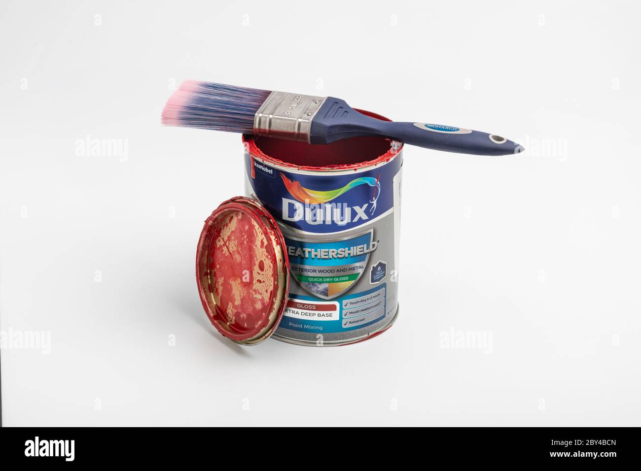 A used paint tin and paint brush Stock Photo Alamy