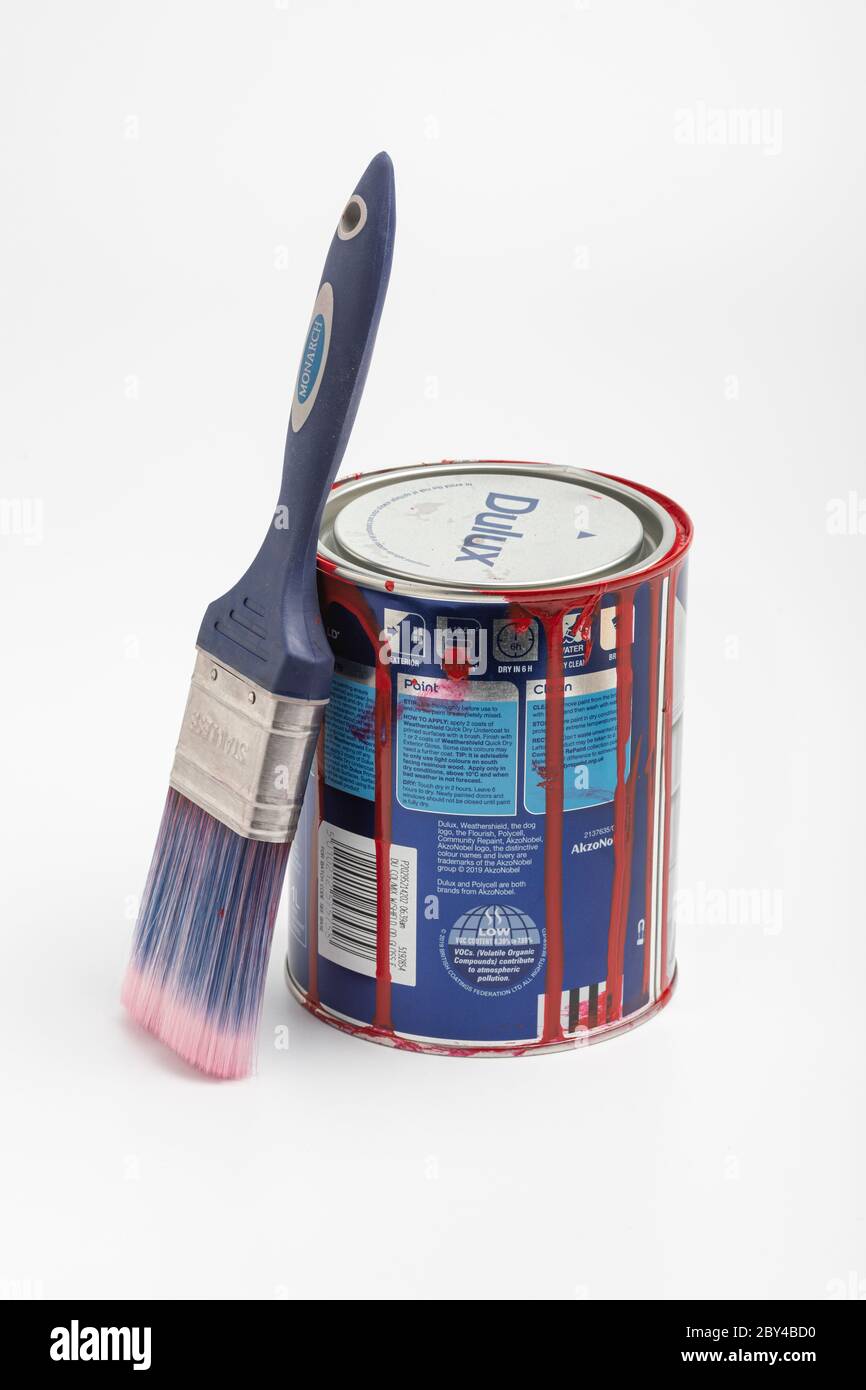 A used paint tin and paint brush Stock Photo