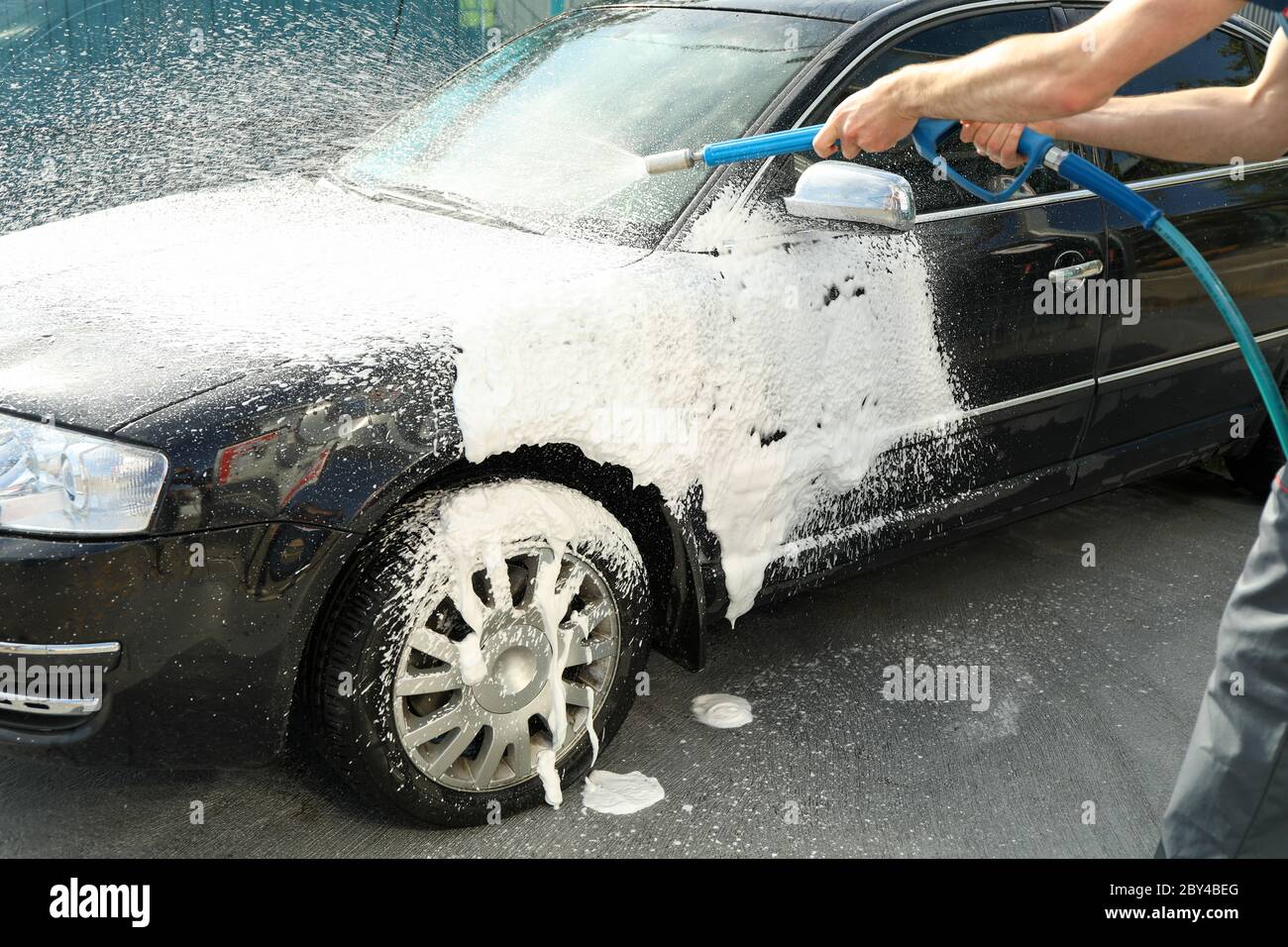 A man washes a car. Clear car concept Stock Photo