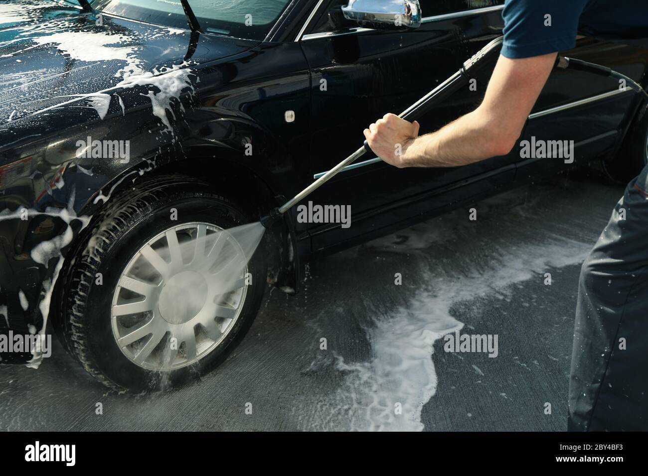 A man washes a car. Clear car concept Stock Photo