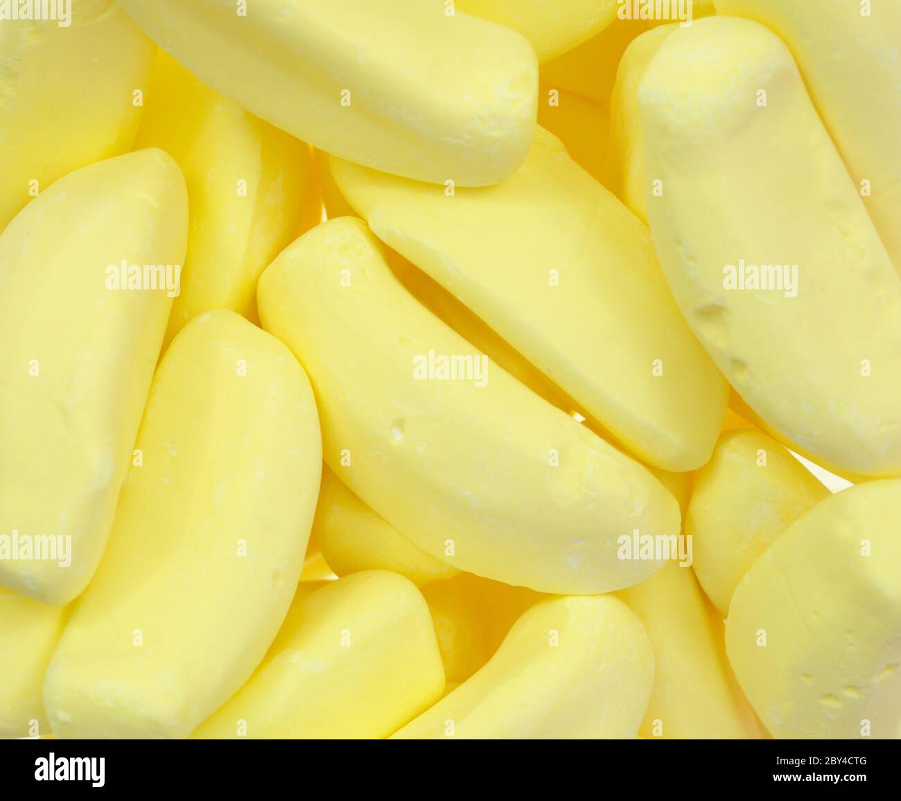 Candy bananas isolated against a white background Stock Photo
