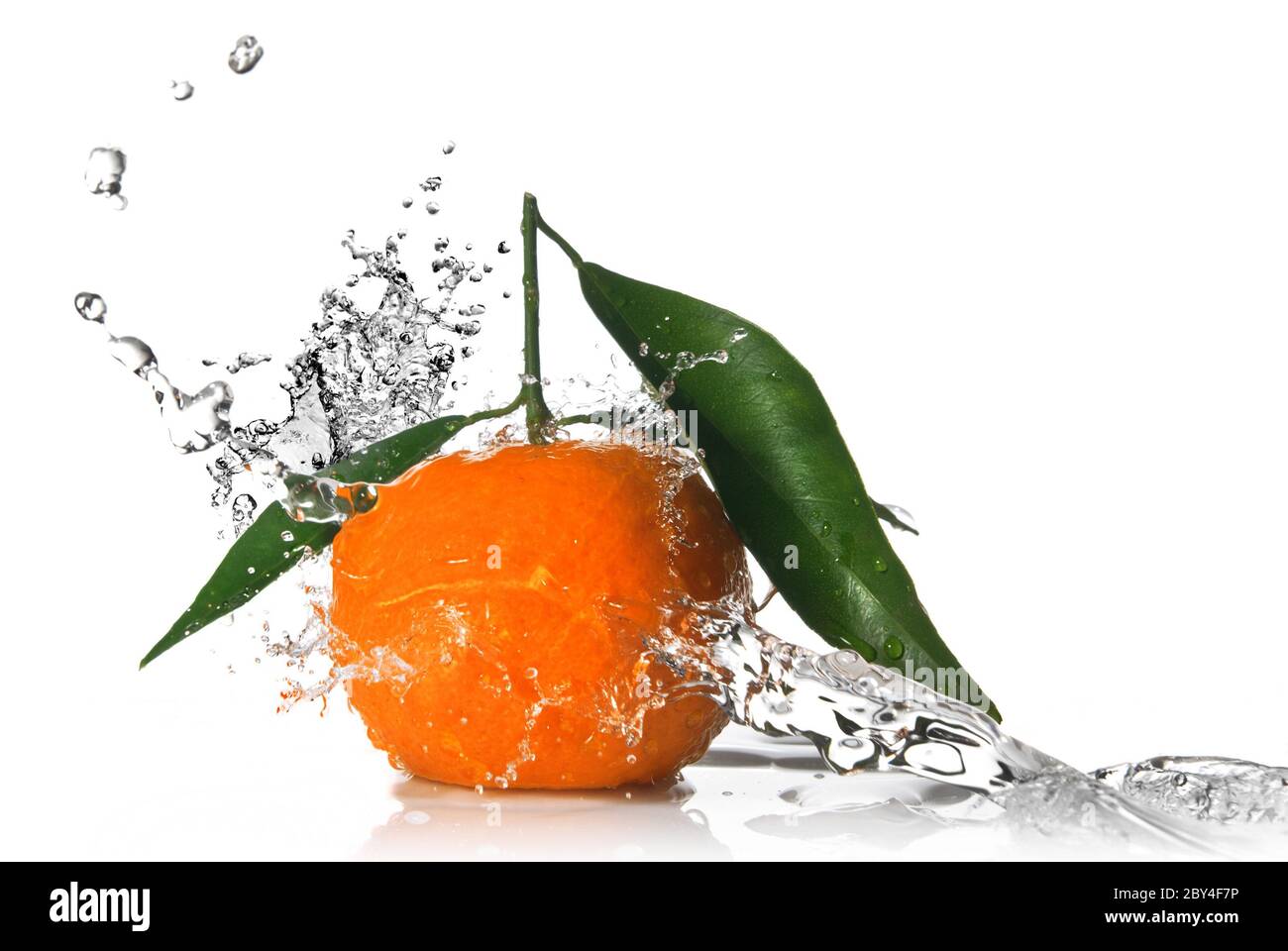 Tangerine with water splash isolated on white Stock Photo Alamy