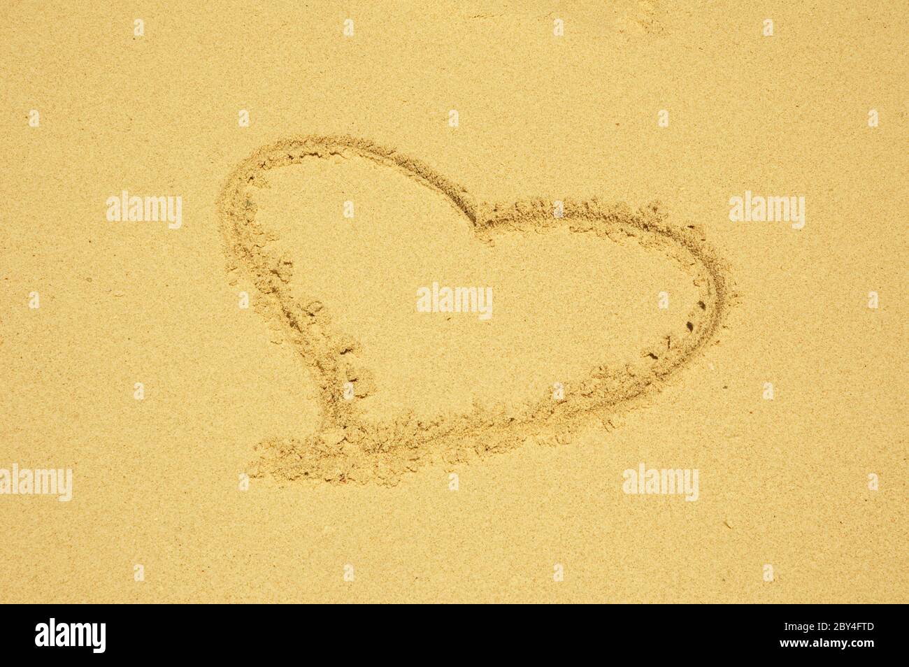 heart drawn in the sand Stock Photo
