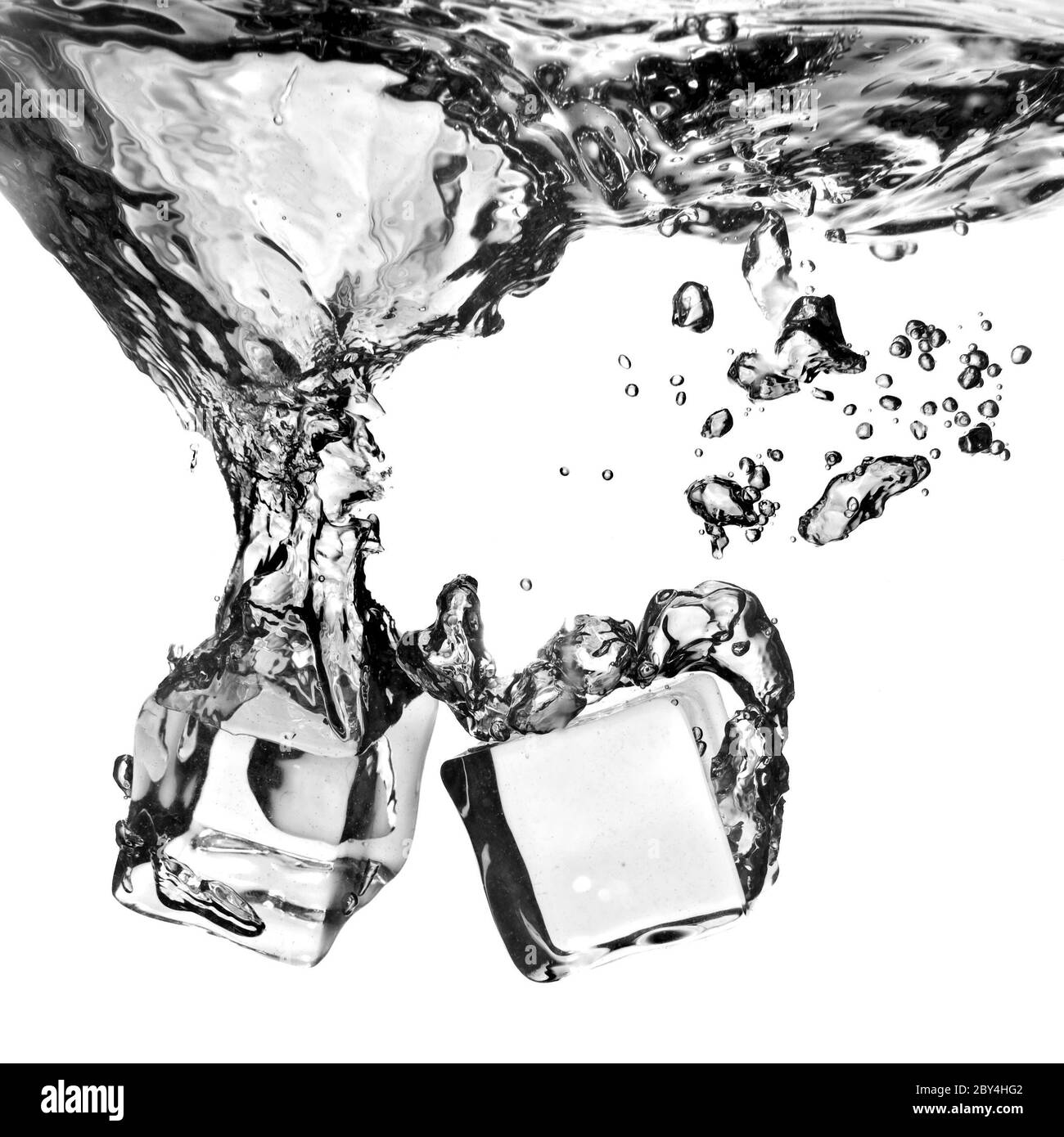 ice cubes dropped into water with splash isolated on white Stock Photo ...