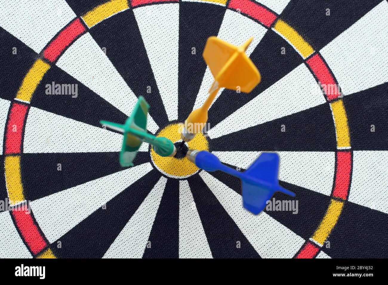 dartboard with darts in aim Stock Photo Alamy