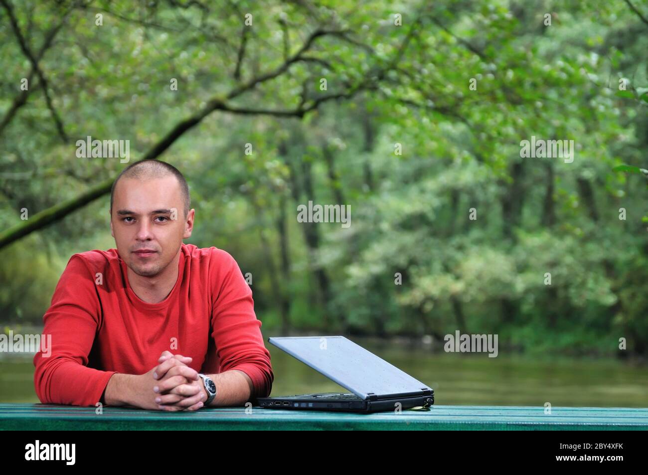 young businessman working on laptop outdoor Stock Photo - Alamy