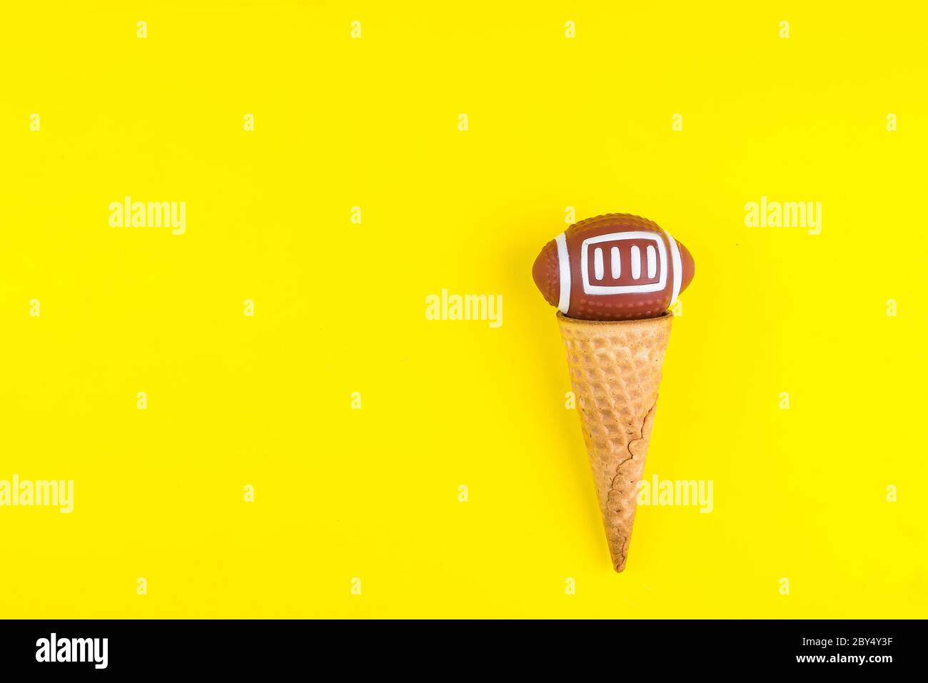 Download Rugby Ball Toy In Ice Cream Waffle Cone On Yellow Background In Minimal Style Concept Sports Entertainment Top View Copy Space Template For Text Or Stock Photo Alamy