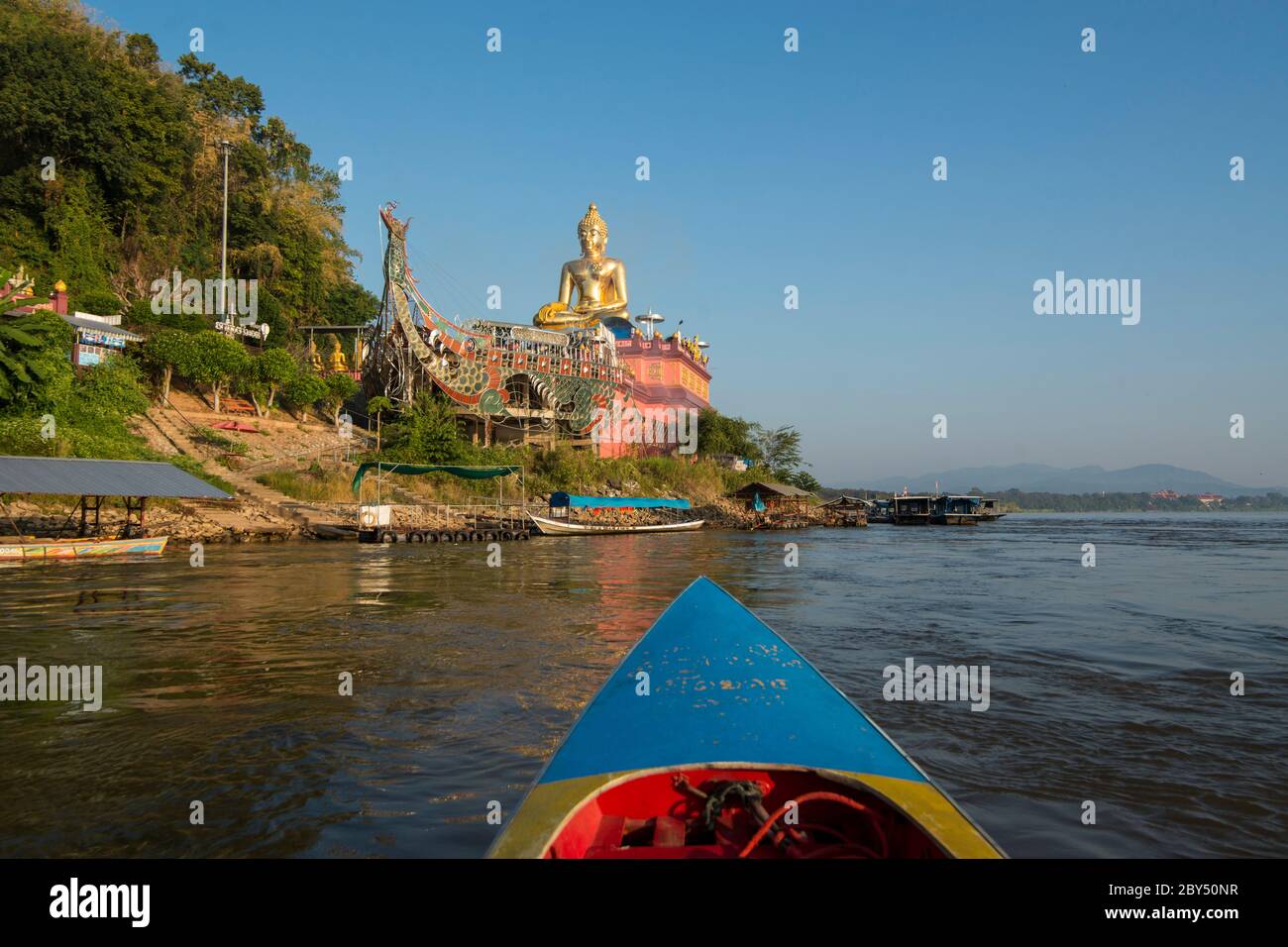 the Giant Buddha on the Dragon Boat Temple at the Mekong River in the town of Sop Ruak in the golden triangle in the north of the city Chiang Rai in N Stock Photo