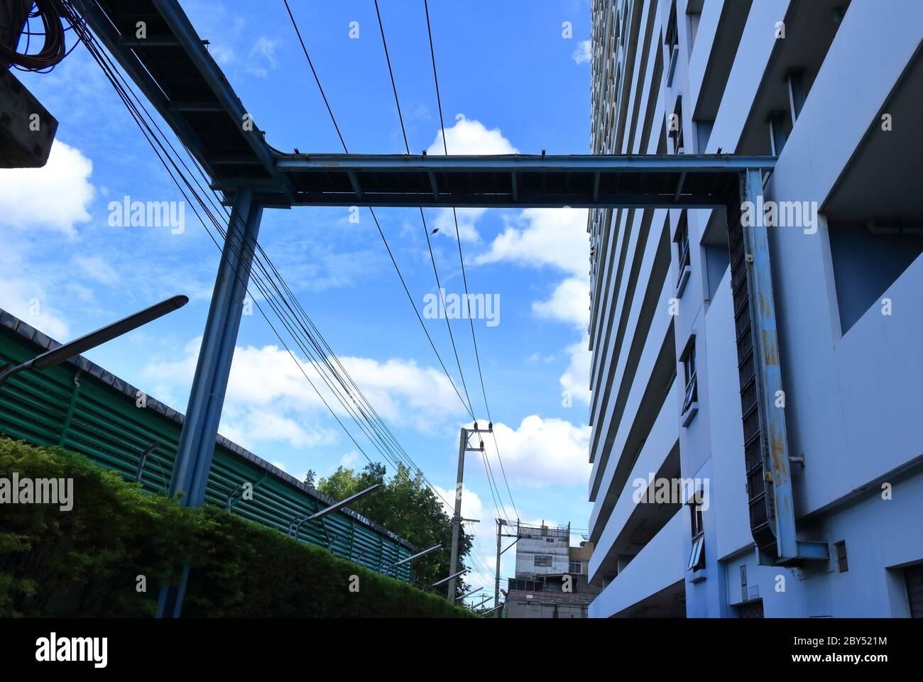 Electrical cable tray run across the street into skyscraper against