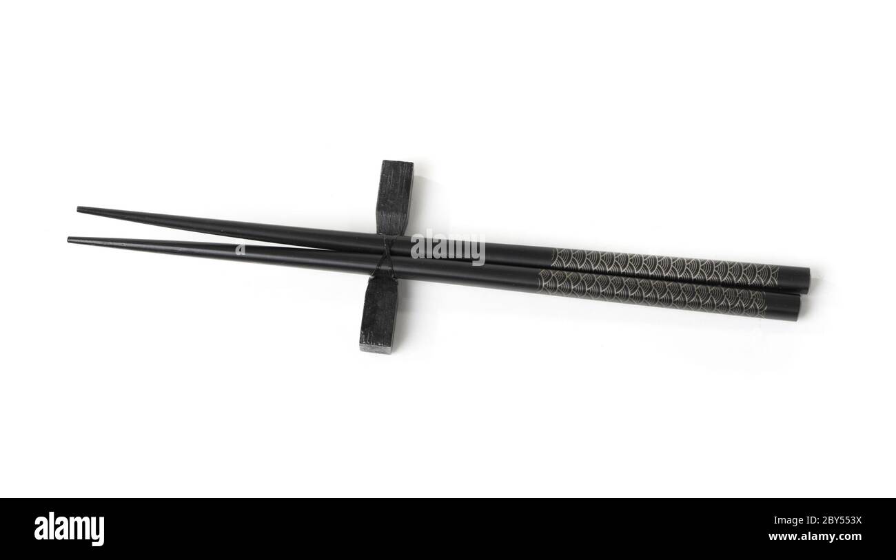 Two black chopsticks isolated Stock Photo Alamy