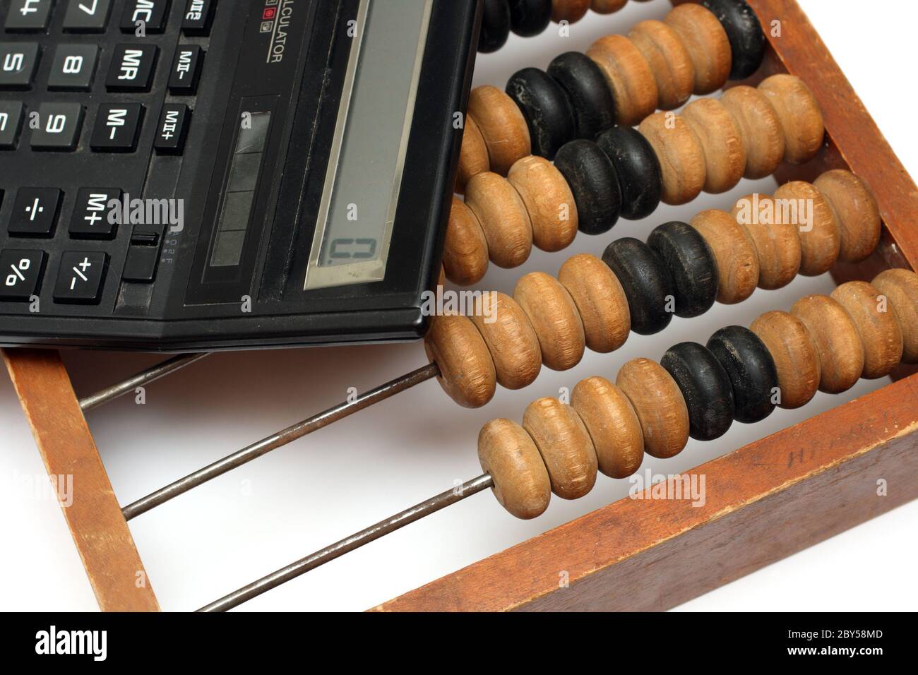 old wooden abacus and electronic calculator Stock Photo