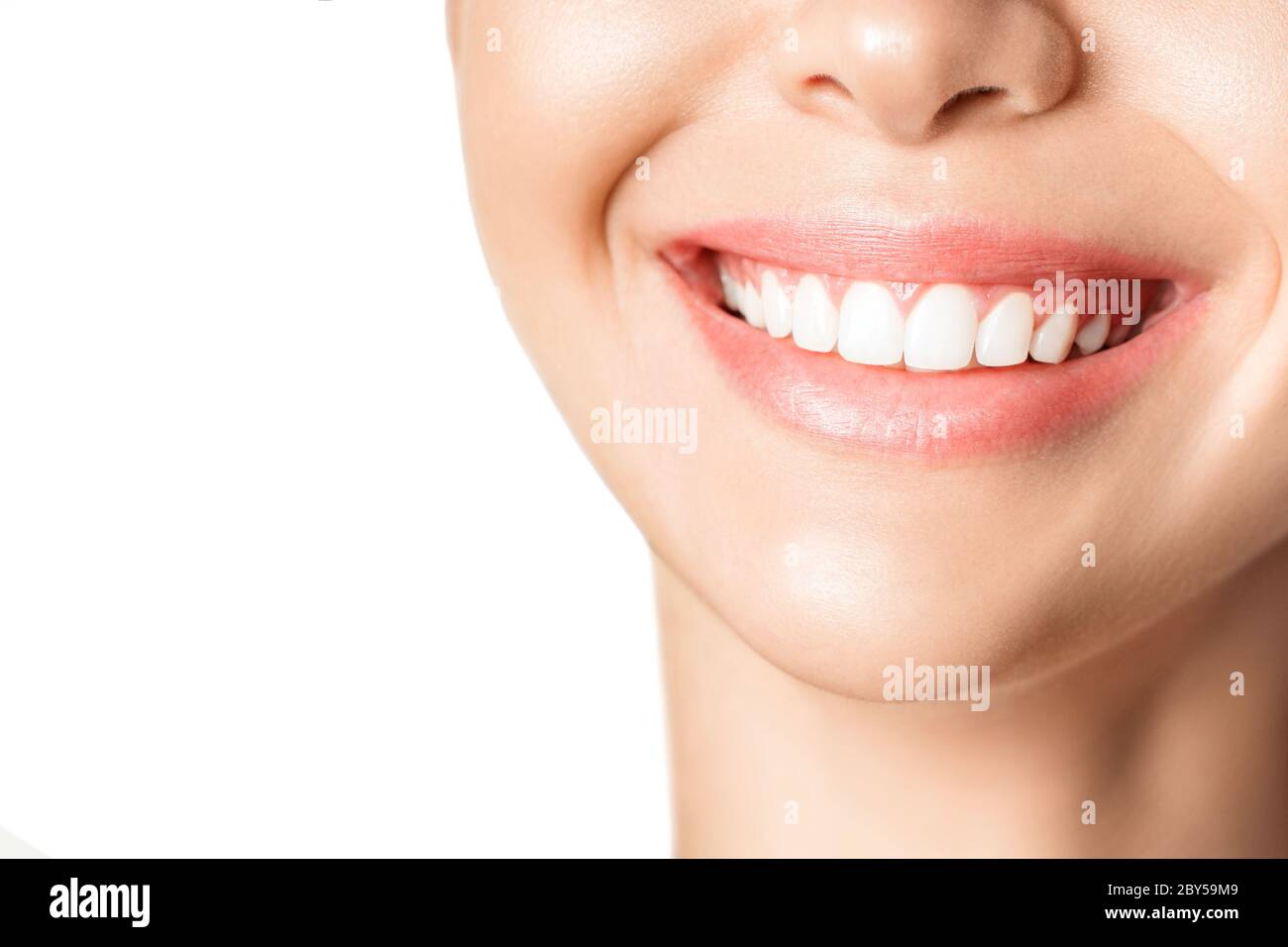 Beautiful young woman with healthy teeth on white background. Stock Photo