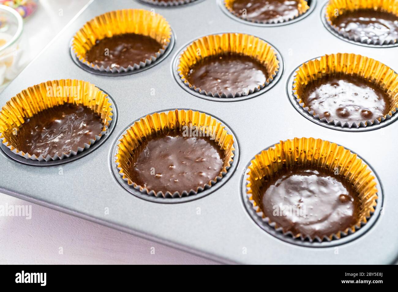 Baking chocolate cupcakes in cupcake pan Stock Photo Alamy