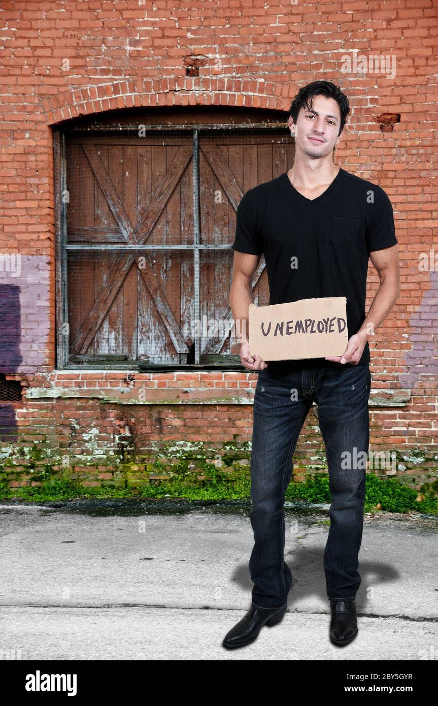 Man Holding an Unemployment Sign Stock Photo - Alamy