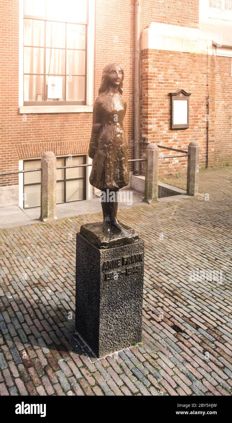 AMSTERDAM, NETHERLANDS - CIRCA APRIL 2009: Anne Frank Monument. Memorial statue of young Jewish girl - victim of holocaust - at Anne Frank's House. Stock Photo