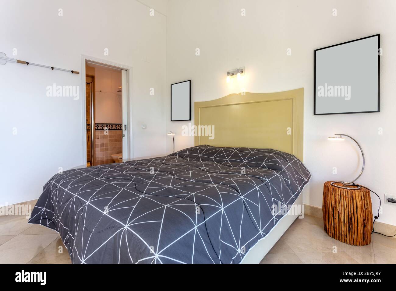 Modern bedroom with open door. European hotel design. Close-up. Stock Photo
