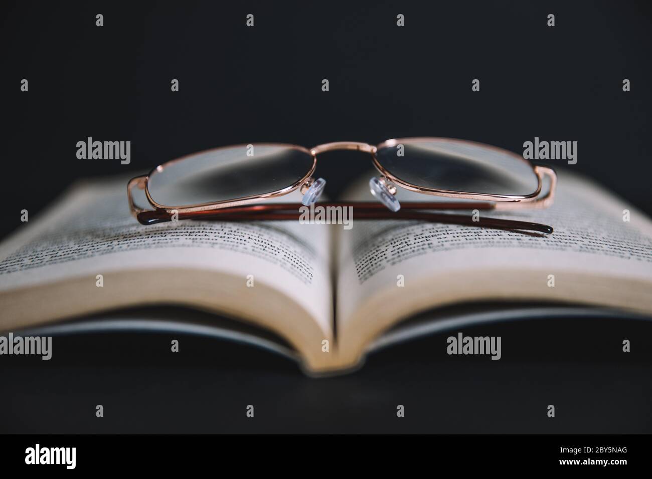 glasses and book Stock Photo Alamy