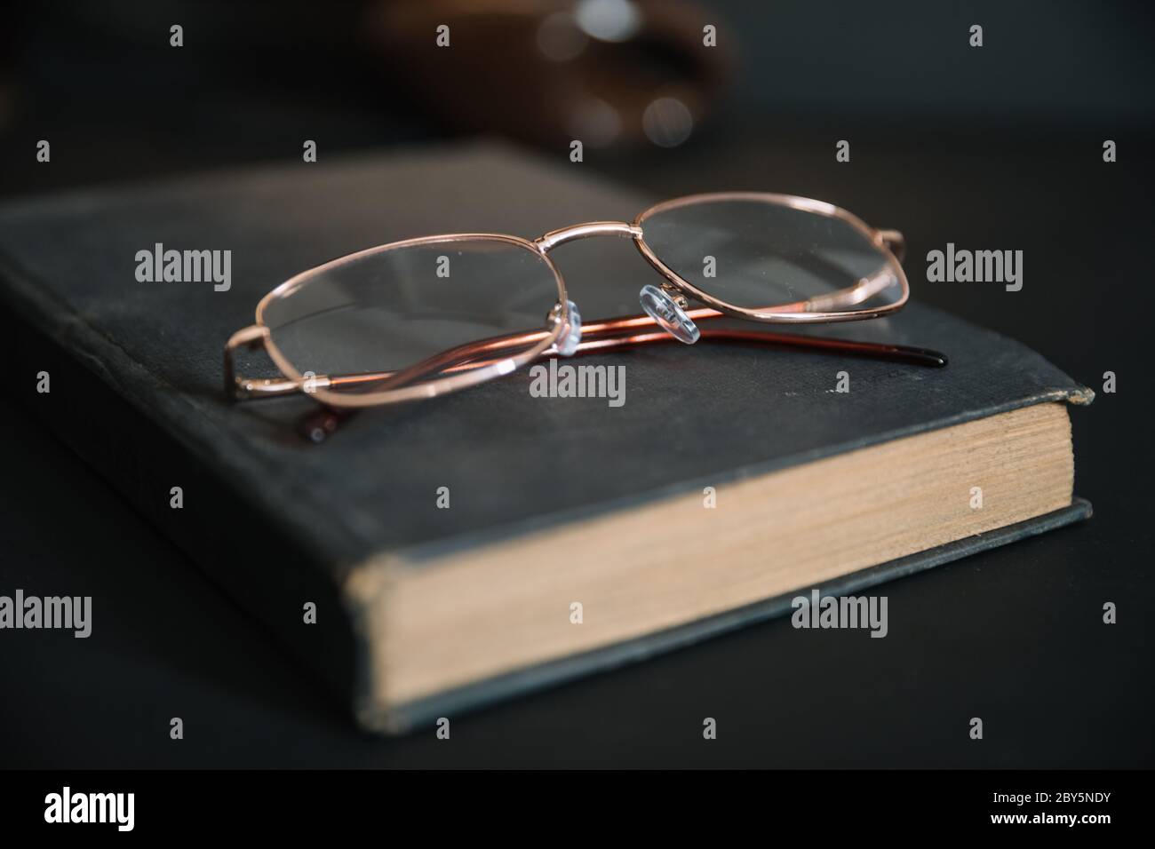 old book and glasses Stock Photo