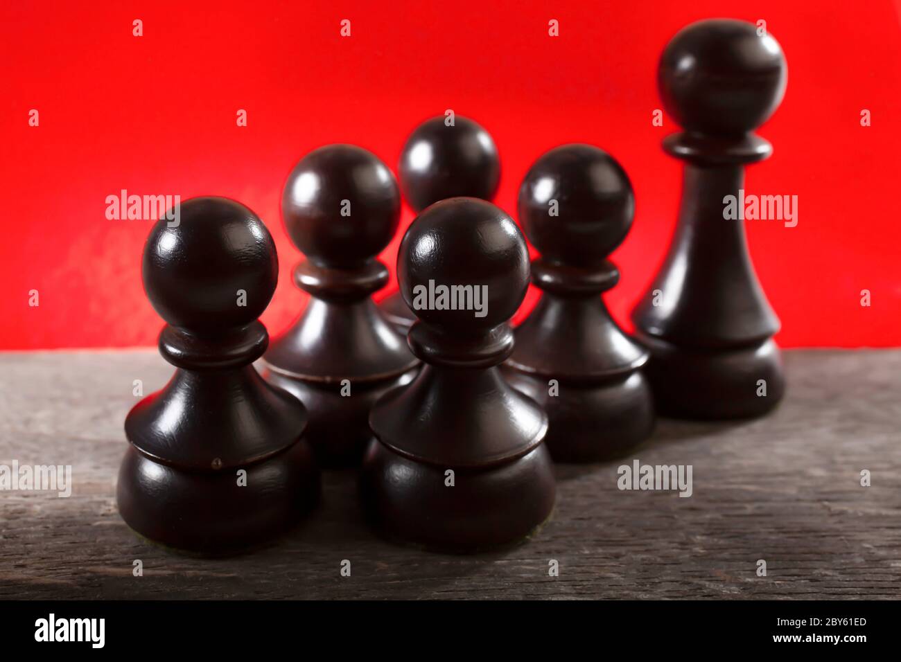 Macro Selective Focus Photo of Black Chess Figures on Red  Color Background Stock Photo