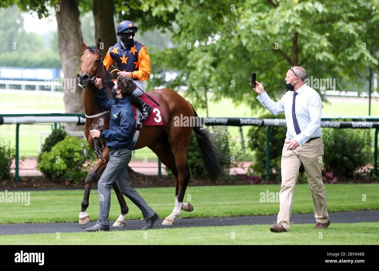 Devious Company and Richard Kingscote after winning the Read Andrew Balding On Betway Insider EBF Maiden Stakes at Haydock Park Racecourse. Stock Photo