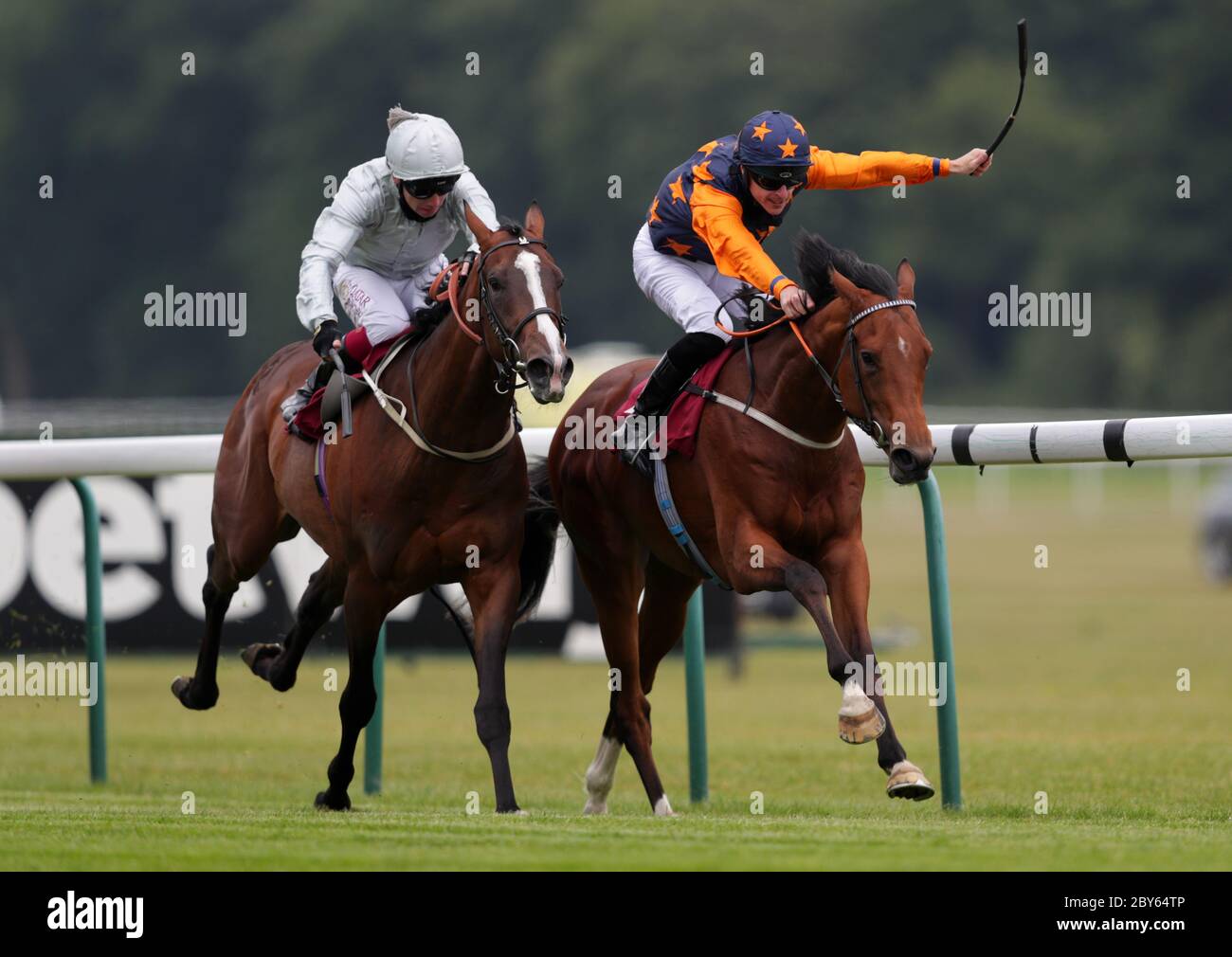 Devious Company and Richard Kingscote (right) wins the Read Andrew Balding On Betway Insider EBF Maiden Stakes at Haydock Park Racecourse. Stock Photo