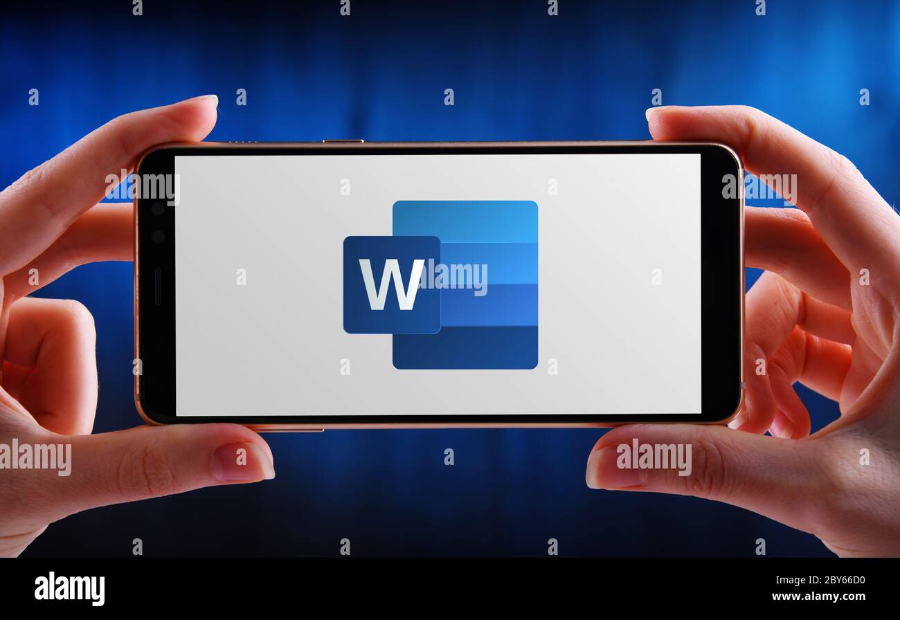 POZNAN, POL MAY 21, 2020 Hands holding smartphone displaying logo of