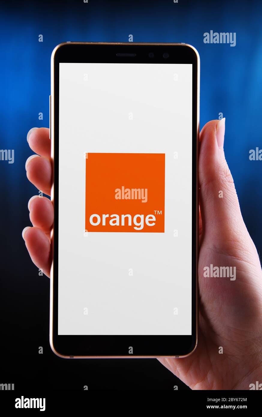 POZNAN, POL - MAY 21, 2020: Hands holding smartphone displaying logo of  Orange S.A., formerly France Telecom S.A., a French multinational  telecommunic Stock Photo - Alamy