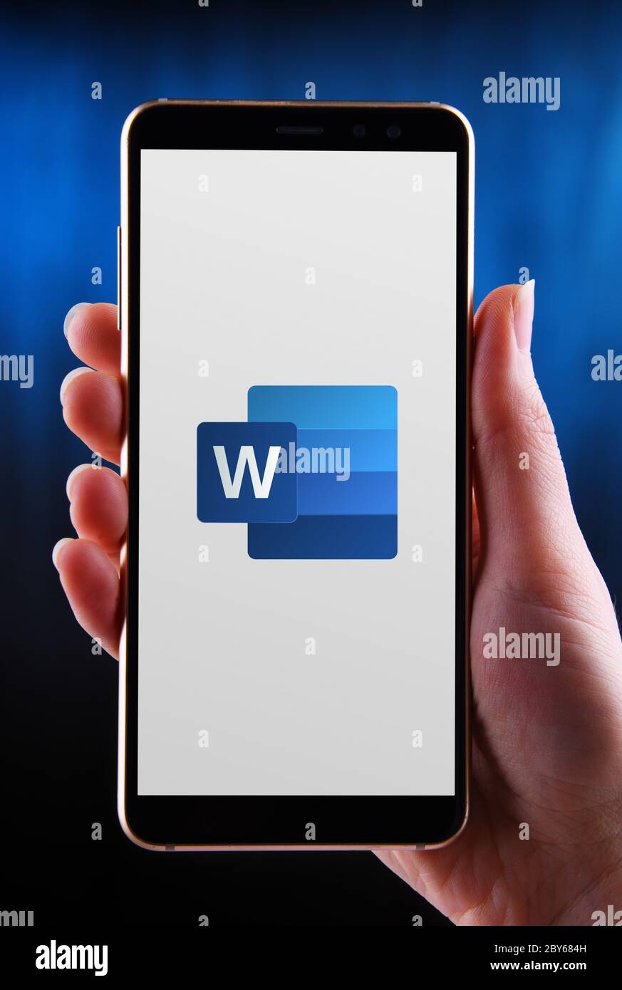 POZNAN, POL MAY 21, 2020 Hands holding smartphone displaying logo of