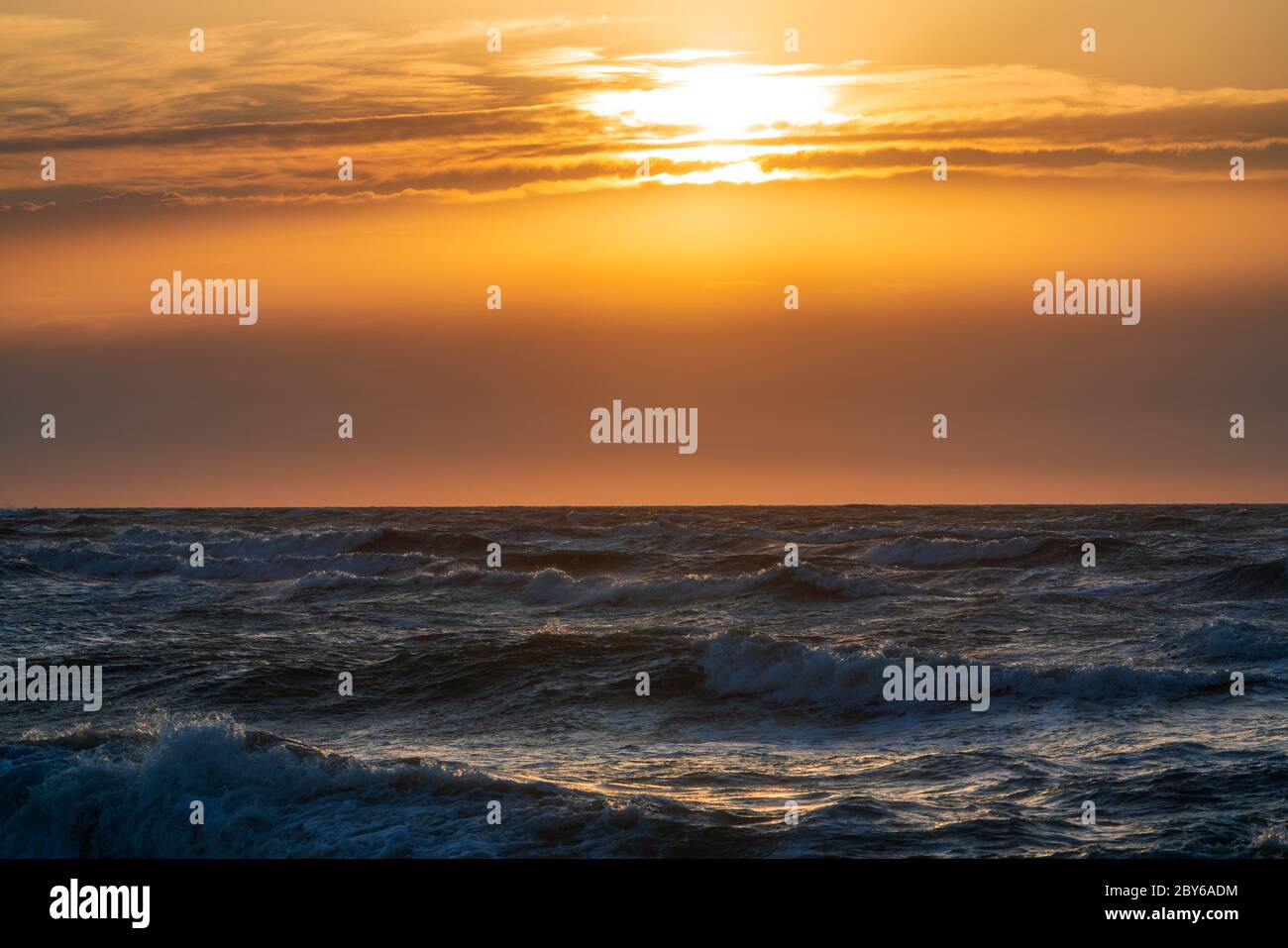 Stormy sea at sunset hi-res stock photography and images - Alamy