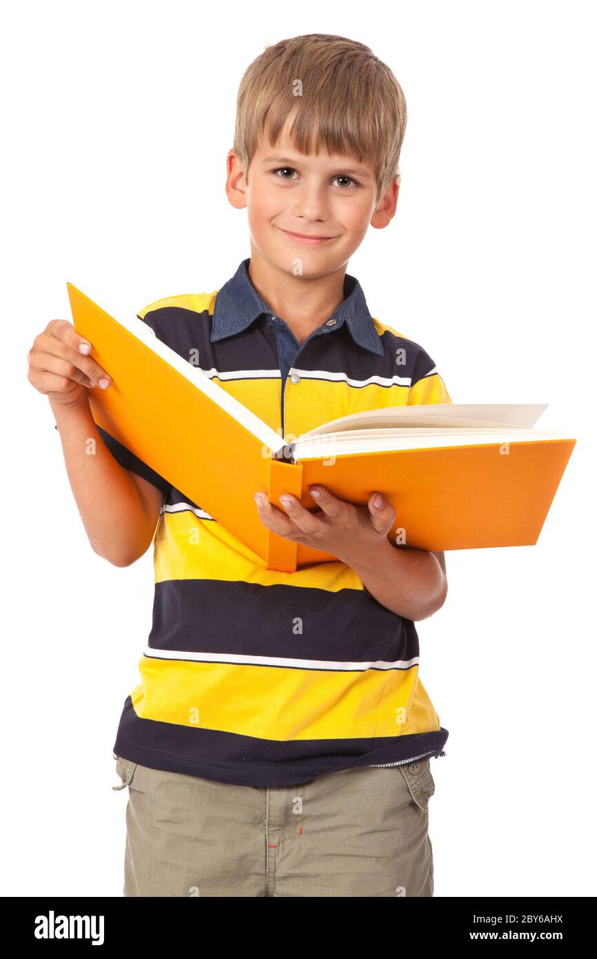 School boy is holding a book Stock Photo - Alamy