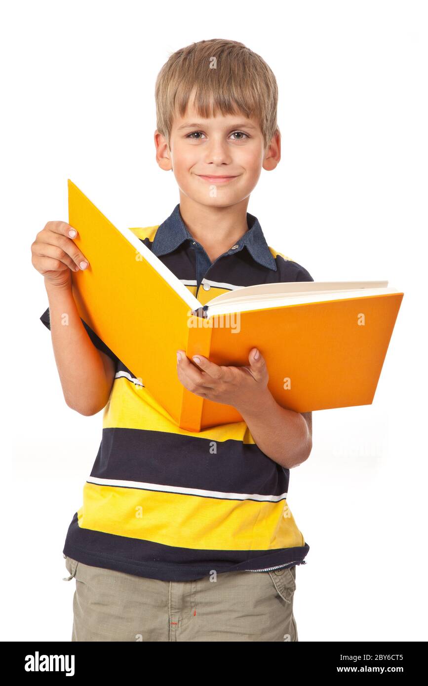 School boy is holding a book Stock Photo - Alamy