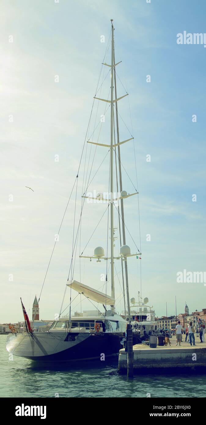 Beautiful yacht moored to the pier at the Schiavoni embankment (Riva degli Schiavoni). Venice. Italy. Stock Photo