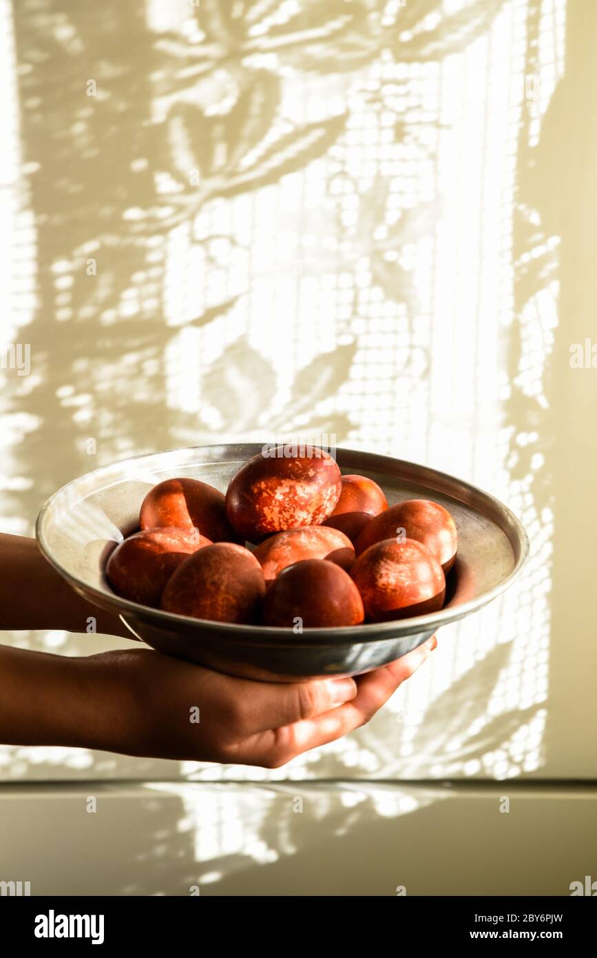 Red easter eggs on a plate. Stock Photo