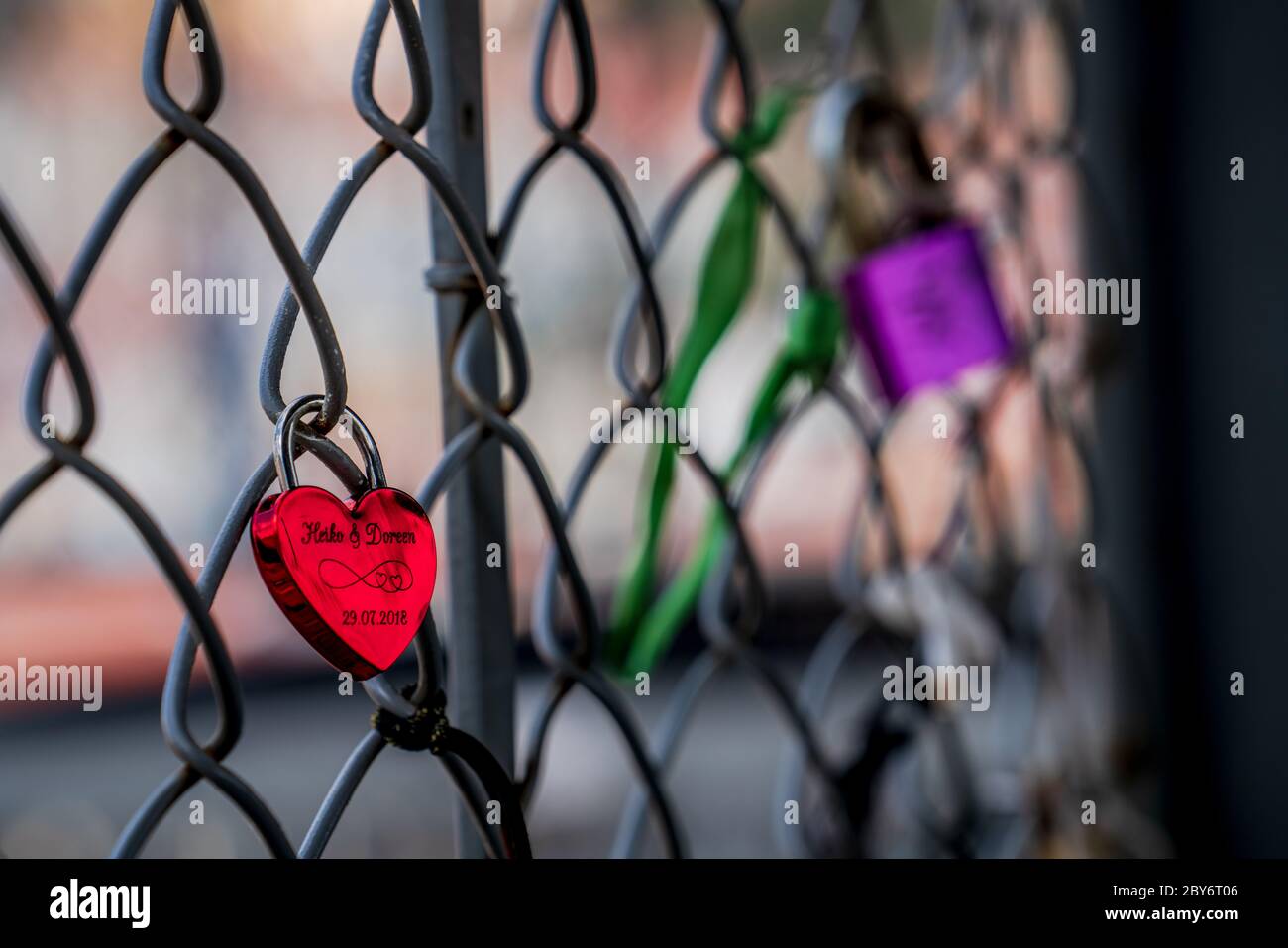 Lovelocks or love padlock that sweethearts lock to a fence on a bridge to symbolize their love for each other. Photograph: Tony Taylor Stock Photo