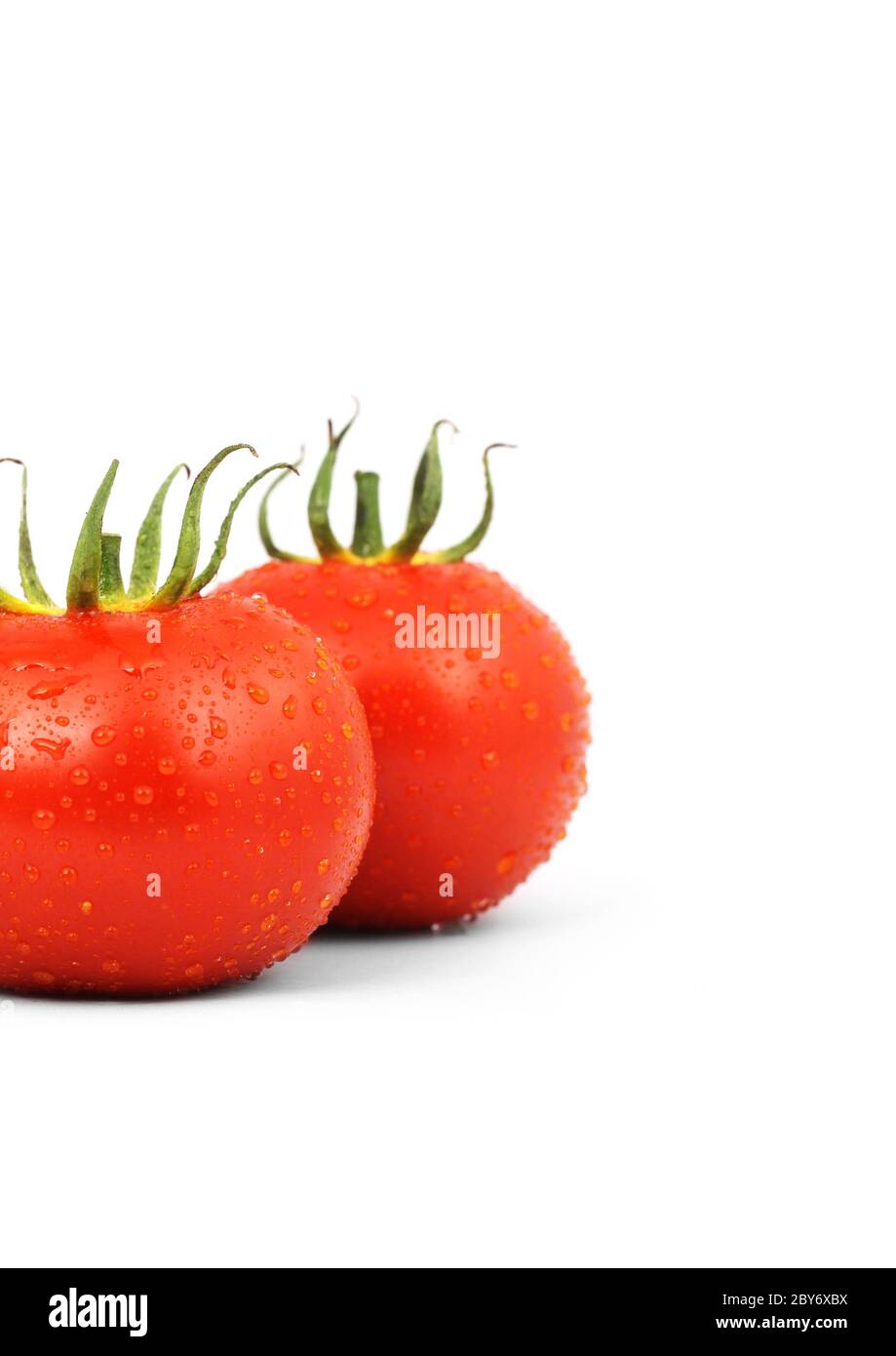 Two red tomatos isolated on white background Stock Photo
