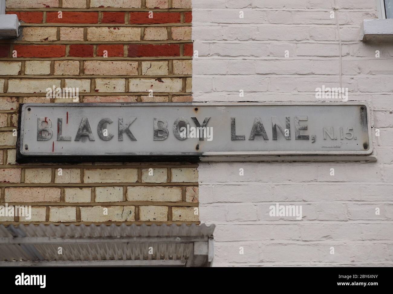 The street sign for Black Boy Lane in north London, as London mayor Sadiq Khan said that London's landmarks Ð including street names, the names of public buildings and plaques Ð will be reviewed to ensure they reflect the capital's diversity after protesters tore down a statue of slave trader Edward Colston in Bristol. Stock Photo