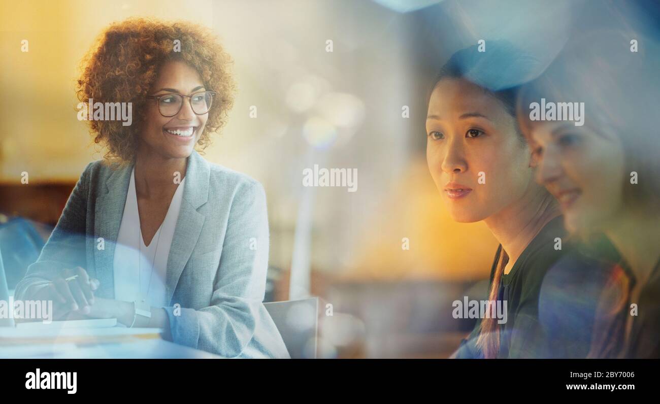 Smiling businesswoman in meeting Stock Photo