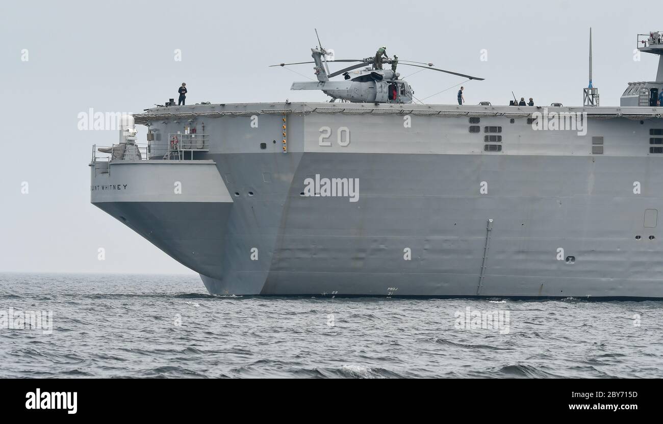 June 23, 2016, the USS Mount Whitney (LCC-20), a command ship for the United States Navy's amphibious warfare and the second Blue Ridge-class ship. It is named after Mount Whitney and has served in the U.S. Navy since 1971, and has been part of the Military Sealift Command since 2004. It is based in Gaeta, Italy and serves as the flagship for the commander of the 6th U.S. fleet. The ship leaving Kiel during the NATO maneuver BALTOPS with a helicopter on the deck. | usage worldwide Stock Photo