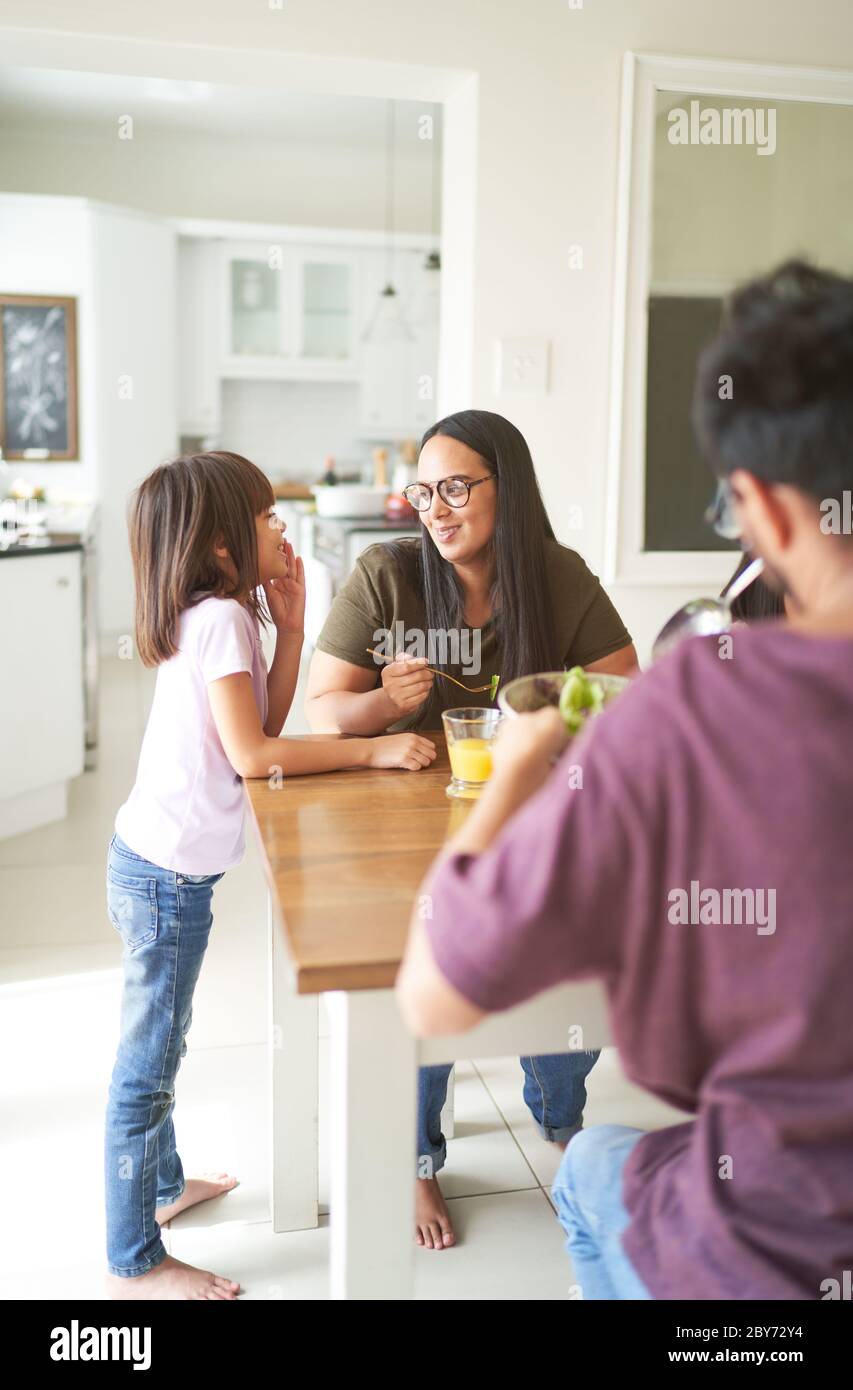 Mother and daughter talking at lunch table Stock Photo