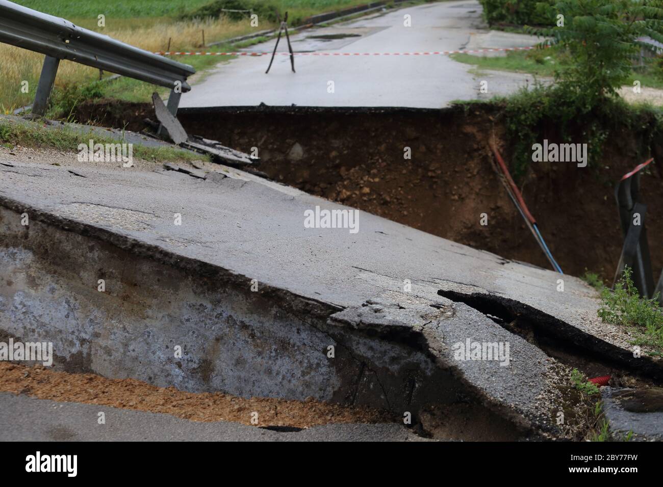 the collapsed bridge and the asphalt destroyed by the storm in San Giorgio A Liri Stock Photo
