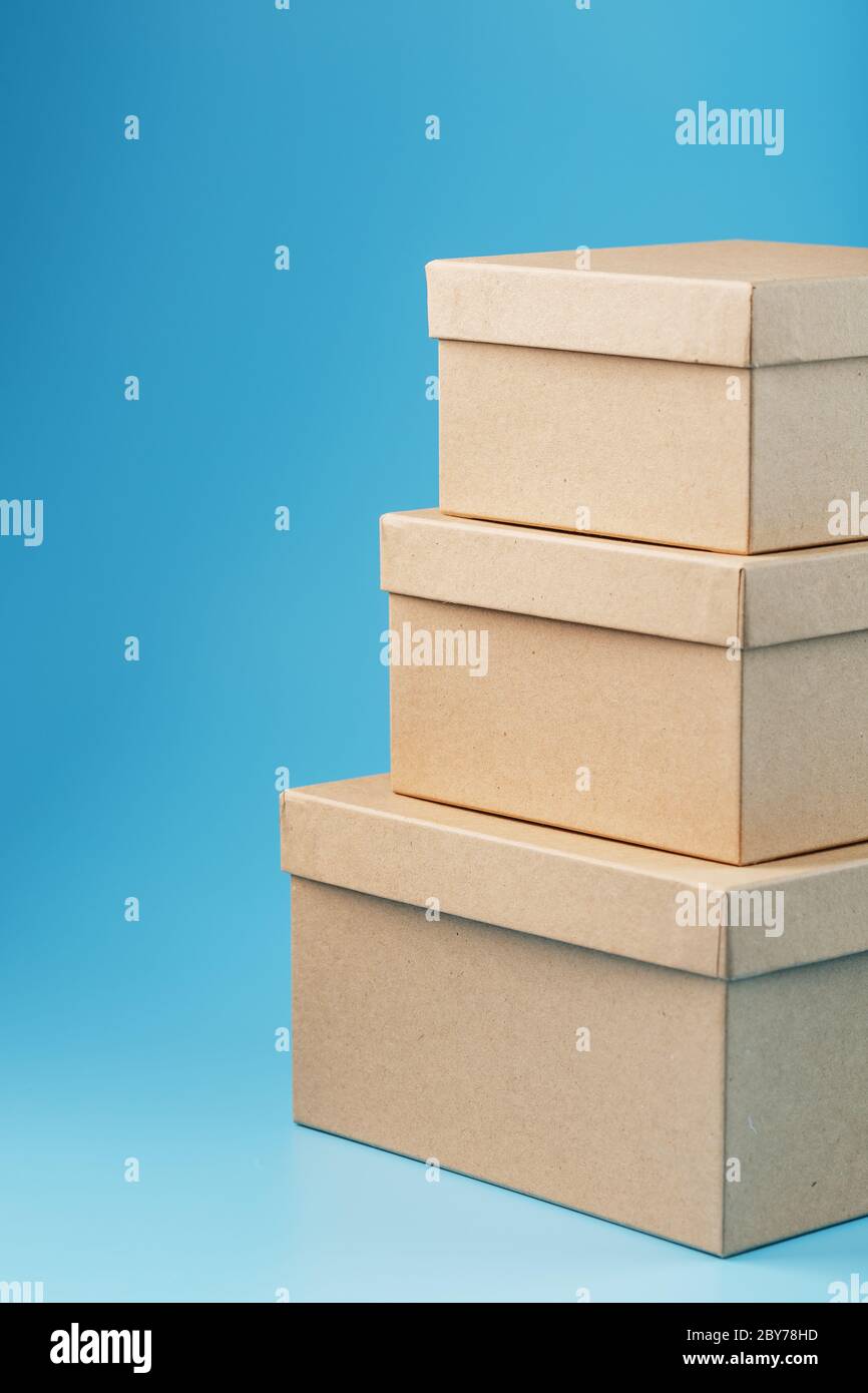 Cardboard boxes on a blue background, free space. isolate Stock Photo
