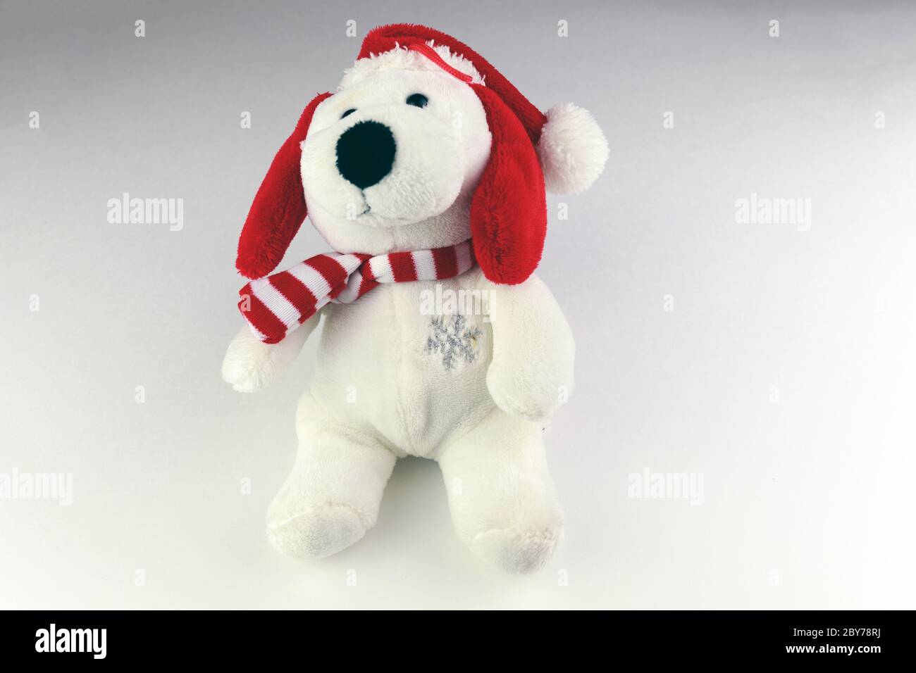 Teddy bear wearing a santa hat isolated on white background Stock Photo ...