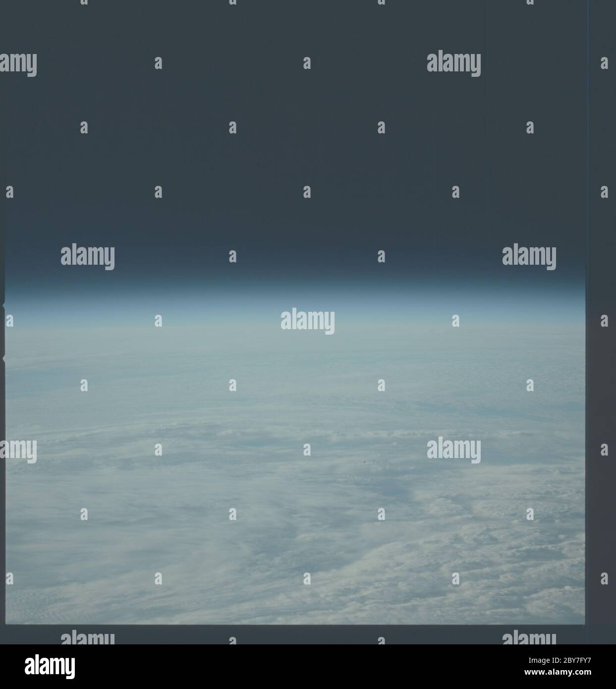 AST-01-022 - Apollo Soyuz Test Project - Apollo Soyuz Test Project, Earth limb; Scope and content:  The original database describes this as: Description: Apollo Soyuz Test Project (ASTP), View of Earth limb with clouds, looking South from 150 degrees East. Image taken on Revolution 17, Greenwich Mean Time (GMT) Time of Photo 197:21:57, Ground Elapsed Time (GET) 26:07, Altitude 189 km. Original Film Magazine: CX-06,Laboratory Roll 1; Camera Data: Hasselbald Reflex,70-mm,Model 500EL,NASA Modified;  Film Data: 70-mm Ektachrome,MS,Type QX-807,ASA=64, 250mm Lens. Subject Terms: Apollo Soyuz Test Pr Stock Photo