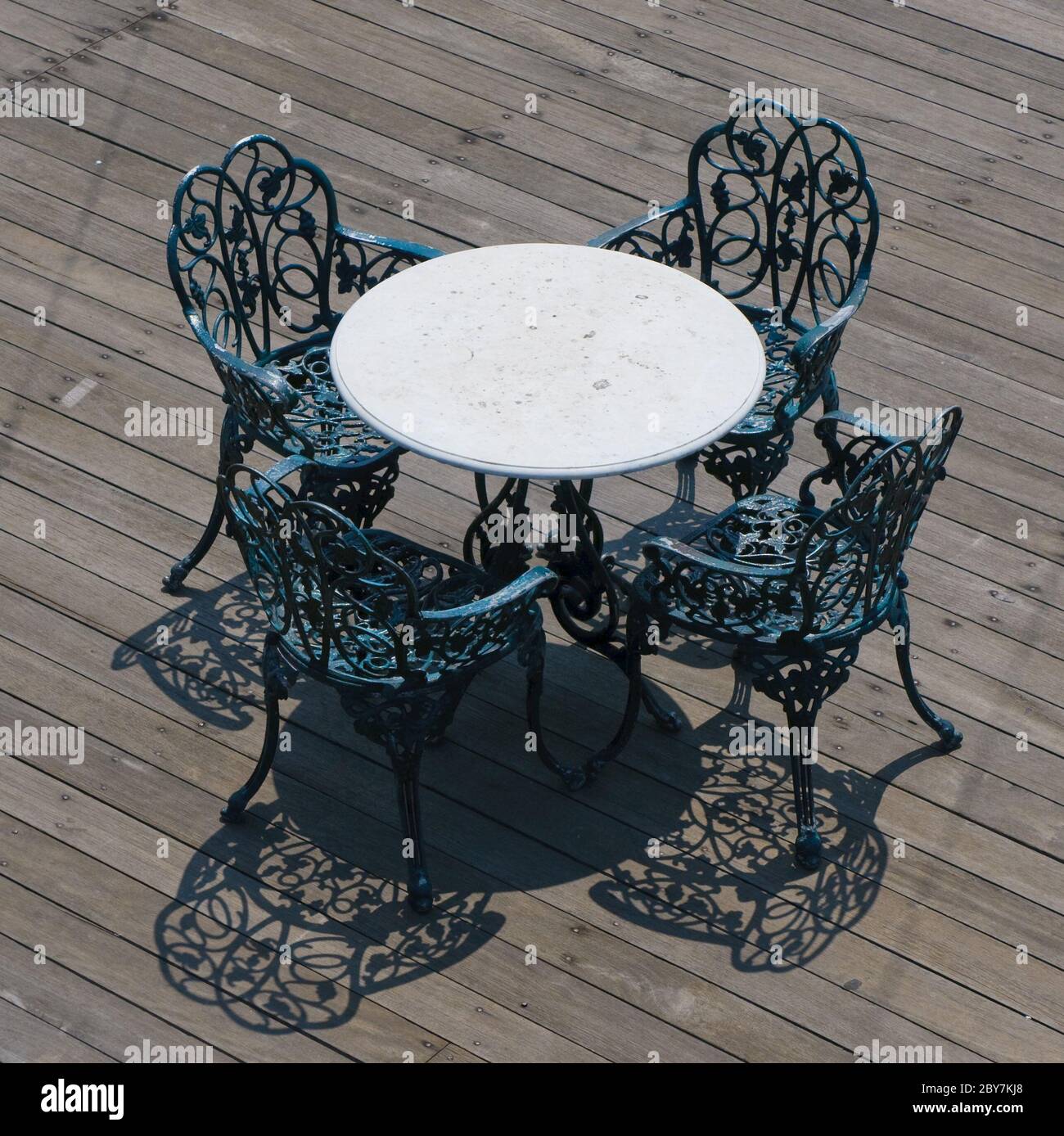 metal chairs and round table Stock Photo Alamy