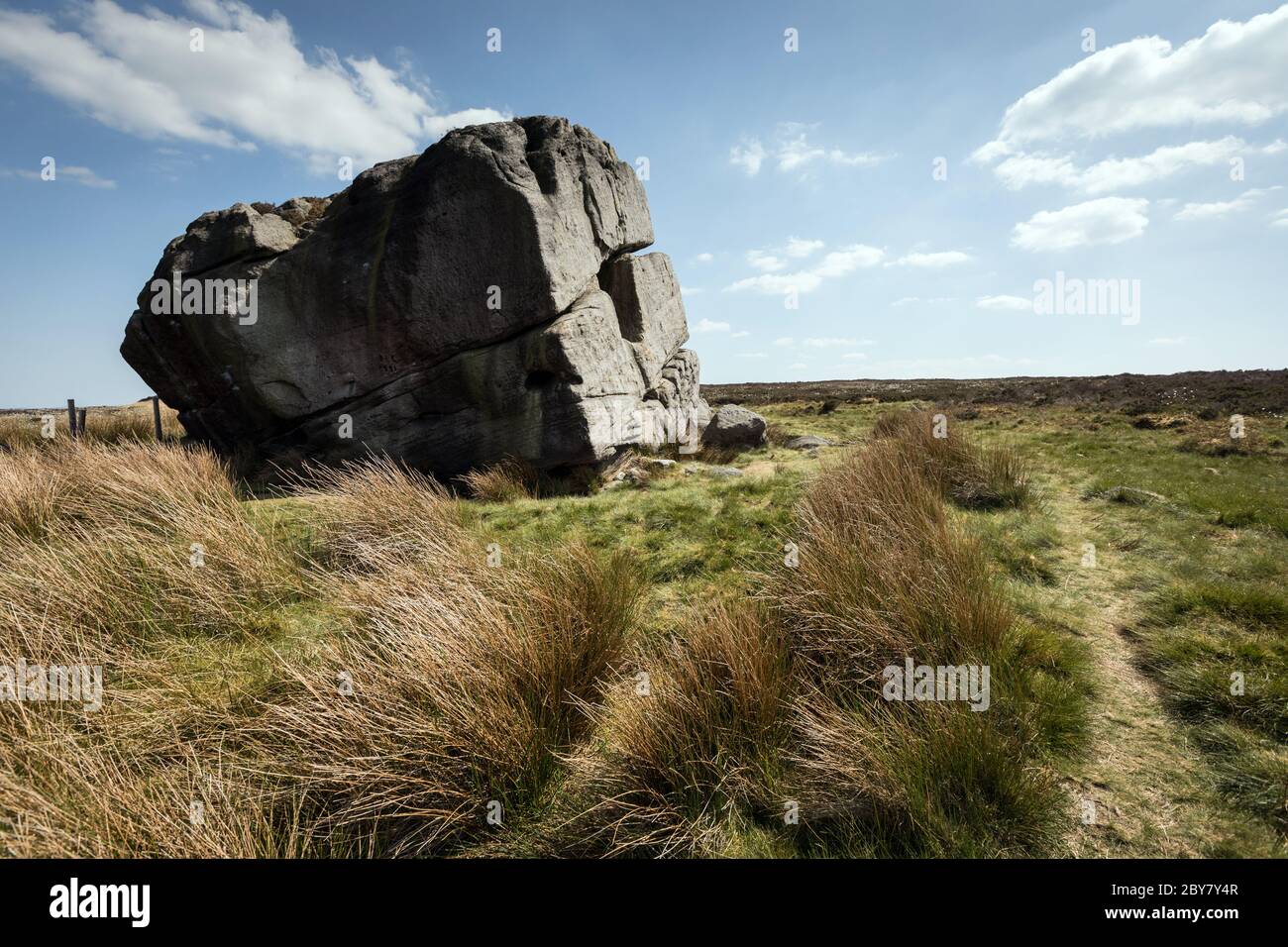 The Hitching Stone, a huge block of gritstone that stands 6.5m high and has been estimated to weigh 1,000 tons. Stock Photo
