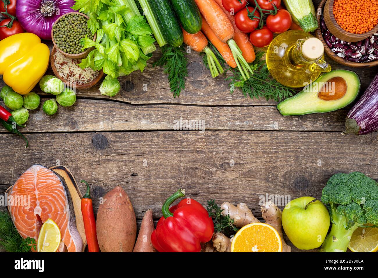 Healthy food background. Selection of balanced food for healthy nutrition.  Assortment of fish salmon, lentils, beans, vegetables and fruits for health  Stock Photo - Alamy