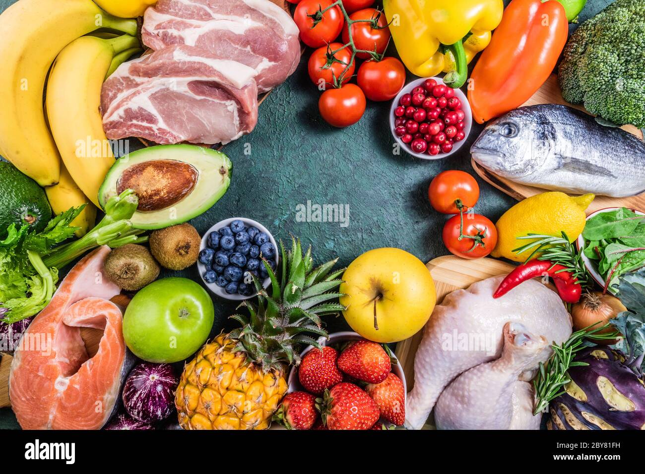 Healthy food to boost immunity. Background of healthy food. Fresh fruits, vegetables, meat and fish on table. Healthy food, diet and healthy life conc Stock Photo